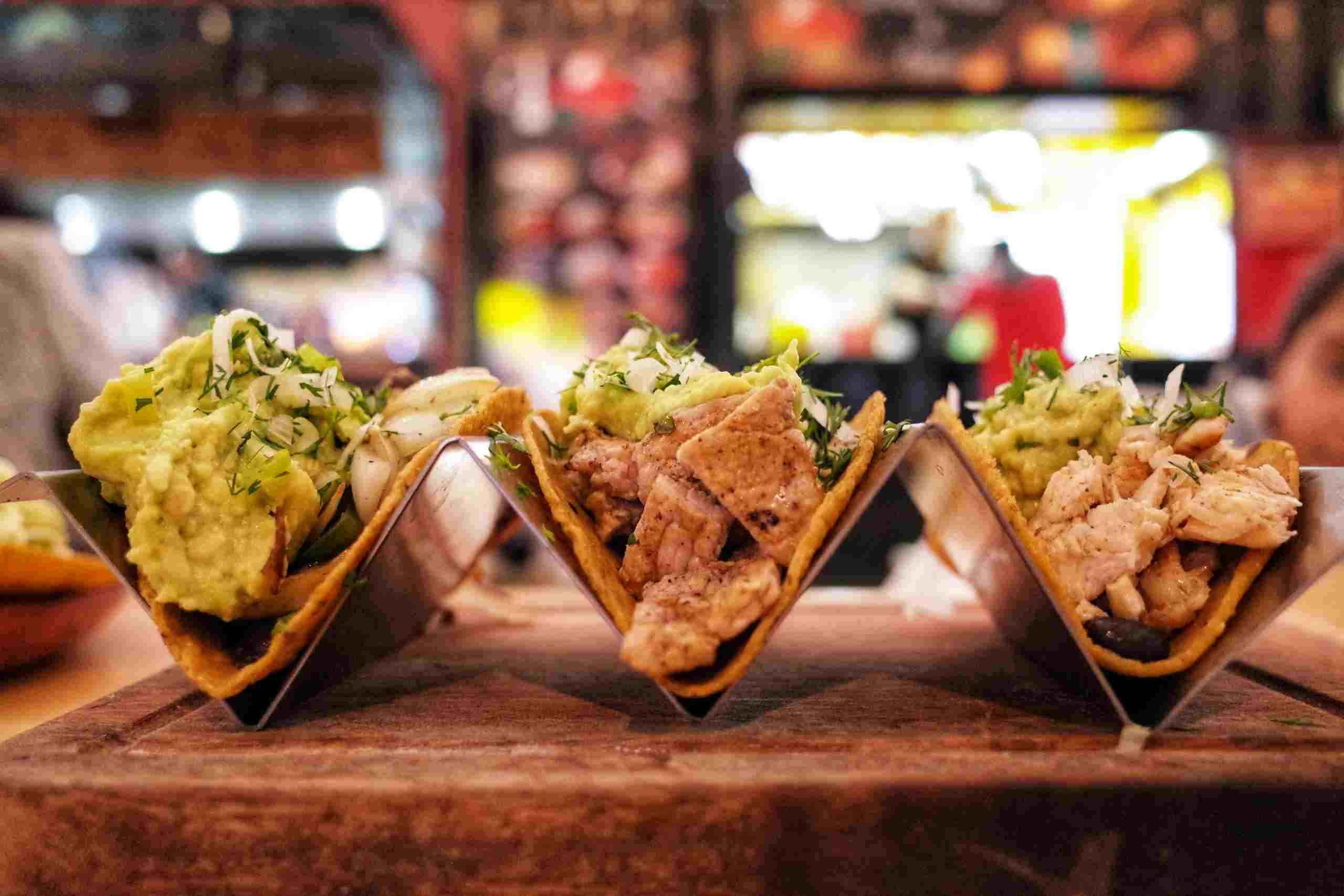 Authentic street-style tacos served in a busy restaurant setting, representing Food Inventory Financing, Beverage Inventory Financing, Restaurant POS Financing, Restaurant Expansion Loans, and Loans for Restaurant Renovations for restaurant owners seeking capital to manage inventory, upgrade technology, expand operations, and renovate dining spaces.
